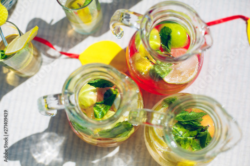 decanters with lemonade apple lemon mint leaves