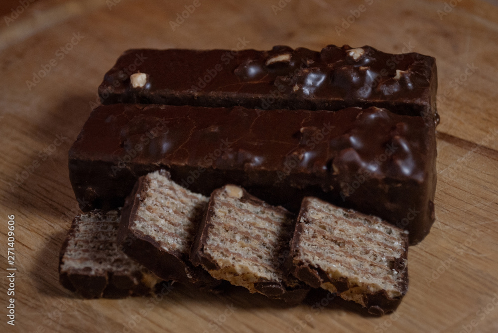 pieces of chocolate on wooden plank pieces of chocolate on wooden plank