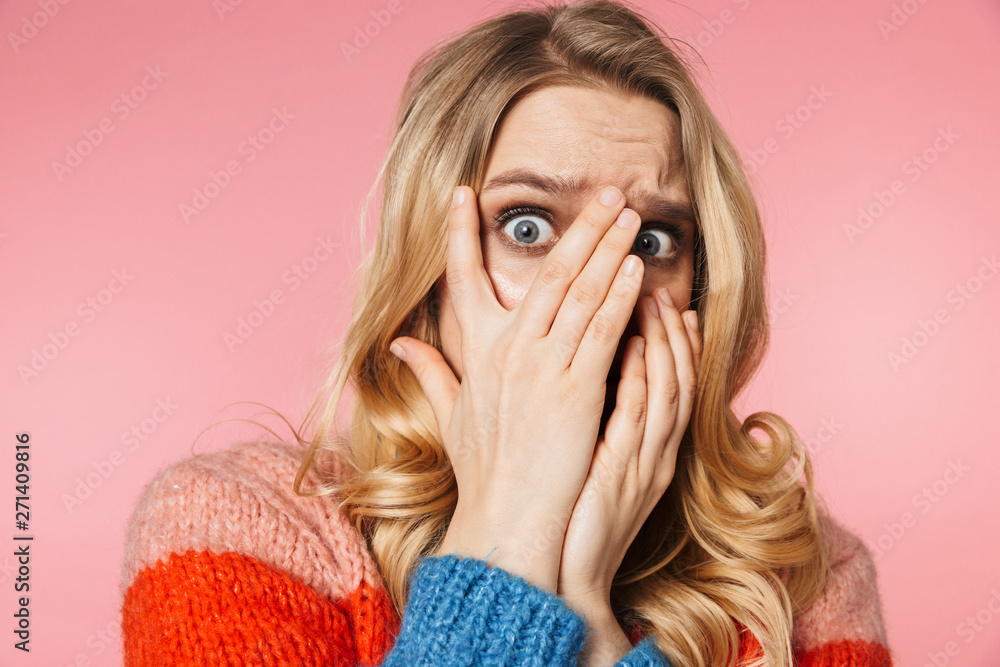 Scared nervous young pretty beautiful woman posing isolated over pink wall background. Scared nervous young pretty beautiful woman posing isolated over pink wall background.
