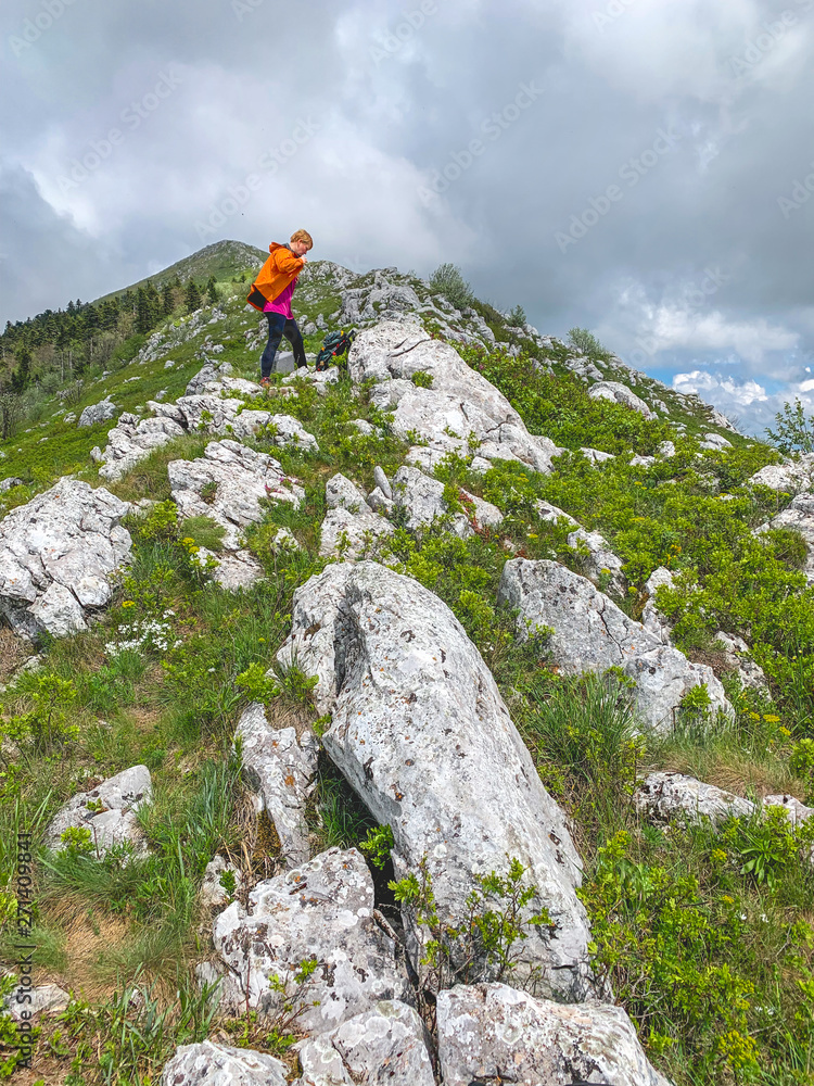 Female hiker on rocky mountain