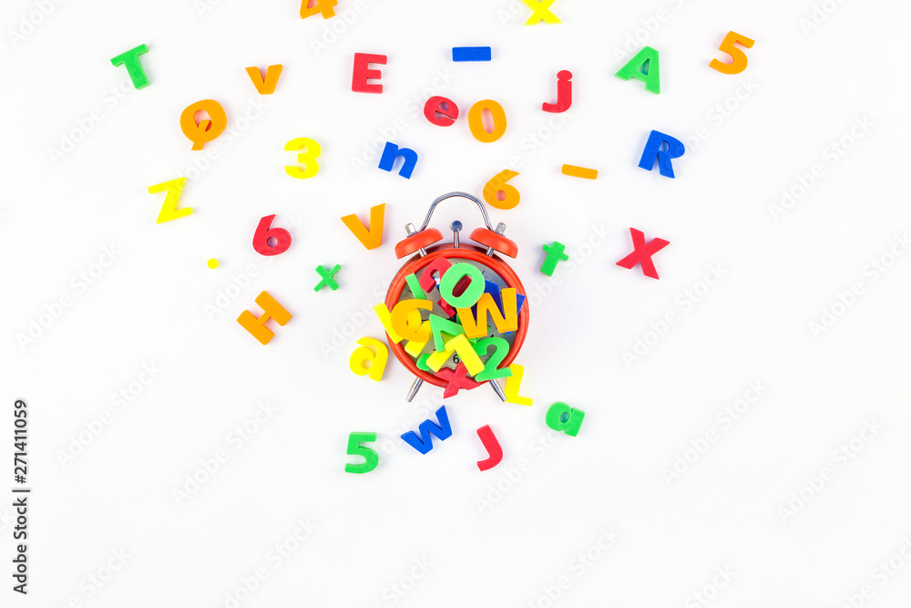 Alarm clock and multicolor alphabet Alarm clock and multicolor alphabet