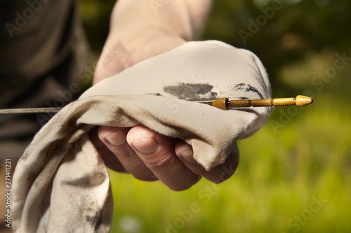 Aging man trying to fix broken car engine on lonely way photo