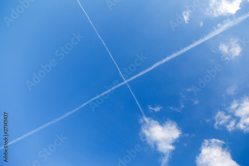White trail of the plane in the sky, inversion, imagine.
