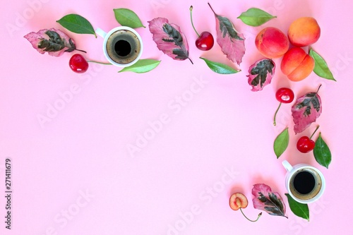 Coffee with fruits and follies on pink background. Top view with copy space. Flat lay style. Summer concept background. photo