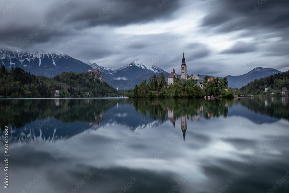 Dramatic sky over Lake Bled with majestic church on island