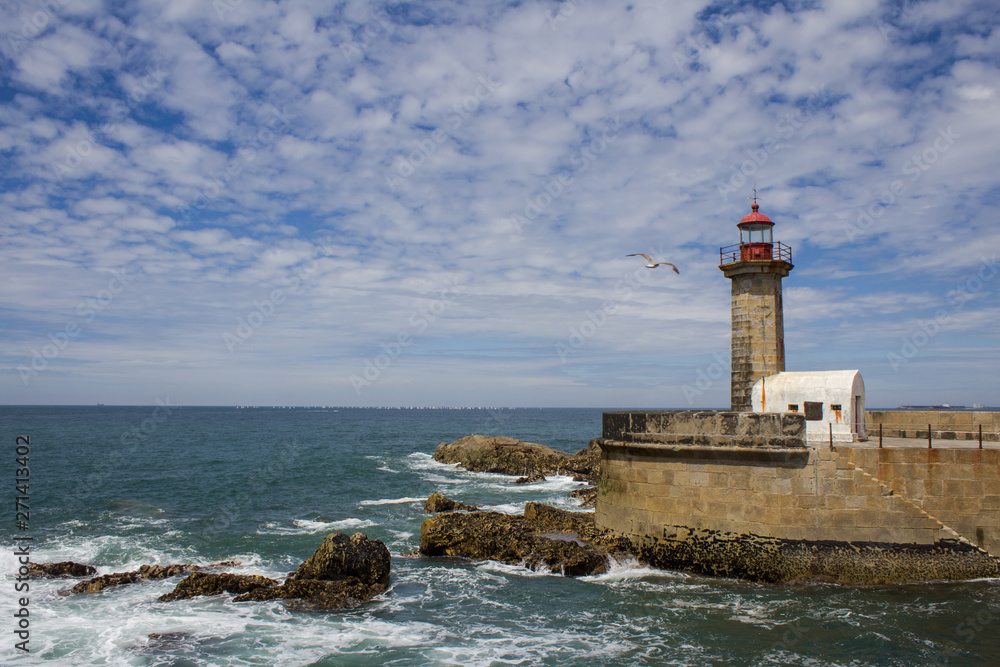 Beautiful Felgueiras Lighthouse on Atlantic Ocean in Porto, Portugal. Beach do Carneiro.