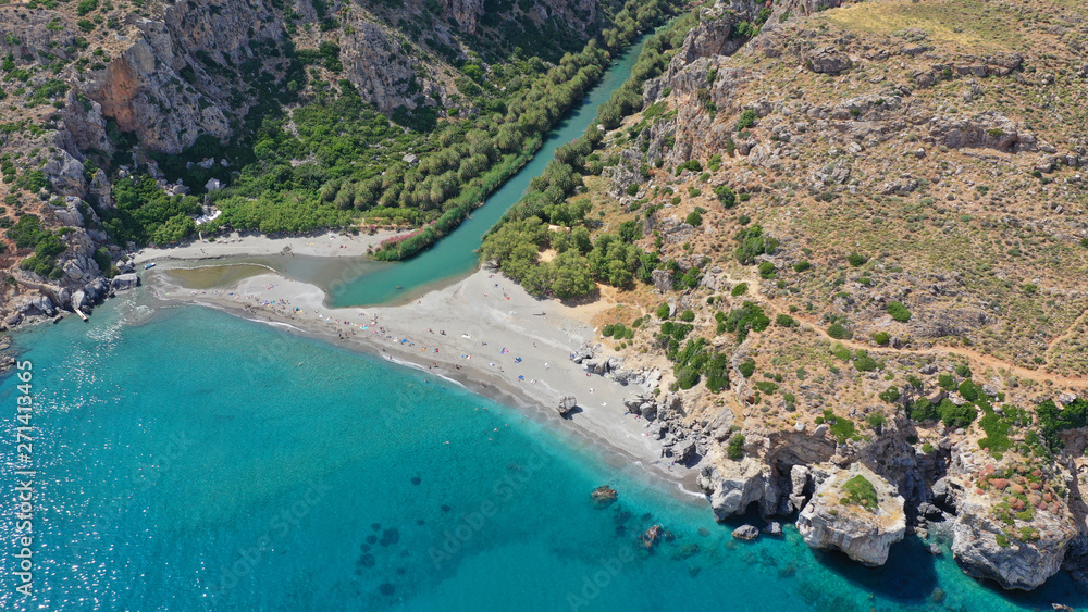 Aerial drone panoramic view of Preveli paradise palm beach and lagoon with Palm trees in the South from city of Rethymno, Crete, Greece