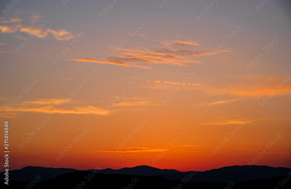 Landscape of mountains at sunset. Beautiful sunset against the mountains