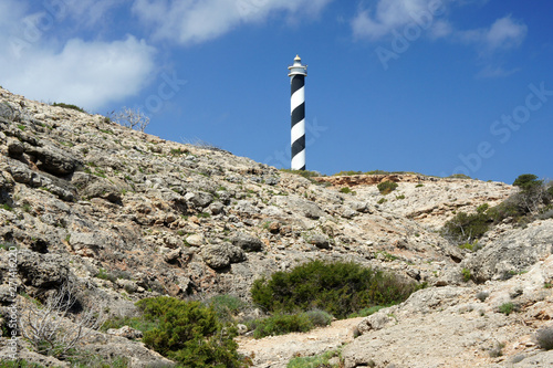 East of the lighthouse Punta des Moscarter, begins a desert plateau Punta Del Gost, composed of old volcanic rocks. photo