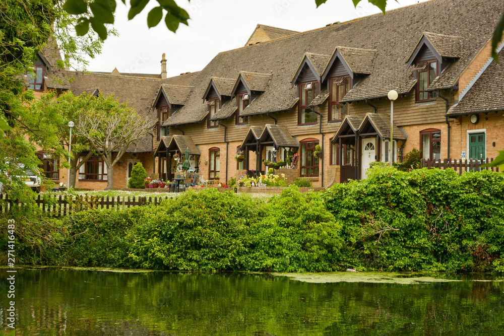 Stamford, England, May 31, 2019 - resident houses along the river. Traditional english houses.