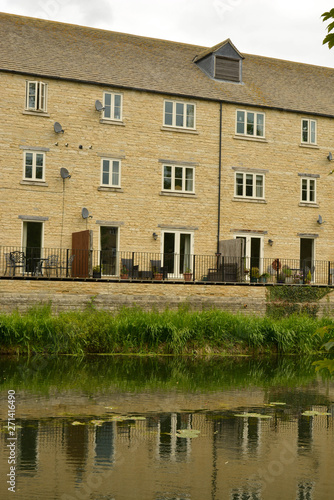 Stamford, England, May 31, 2019 - resident houses along the river. Traditional english houses.