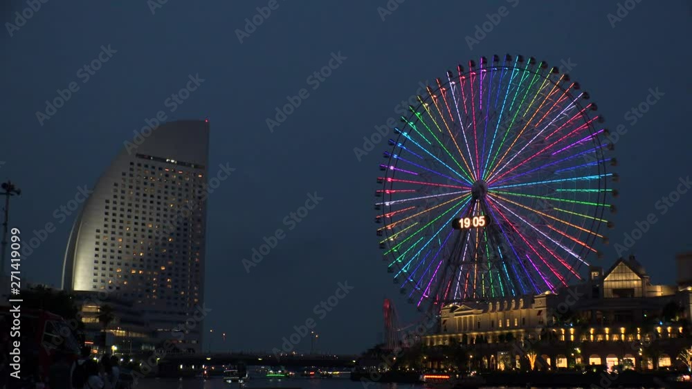 YOKOHAMA, KANAGAWA, JAPAN - 2 JUNE 2019 : Scenery of ferris wheel and sea near Minatomirai station in Yokohama city. YOKOHAMA, KANAGAWA, JAPAN - 2 JUNE 2019 : Scenery of ferris wheel and sea near Minatomirai station in Yokohama city.