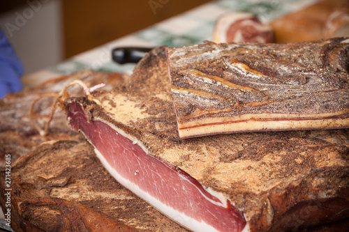 Traditional smoked speck sliced on site during the 