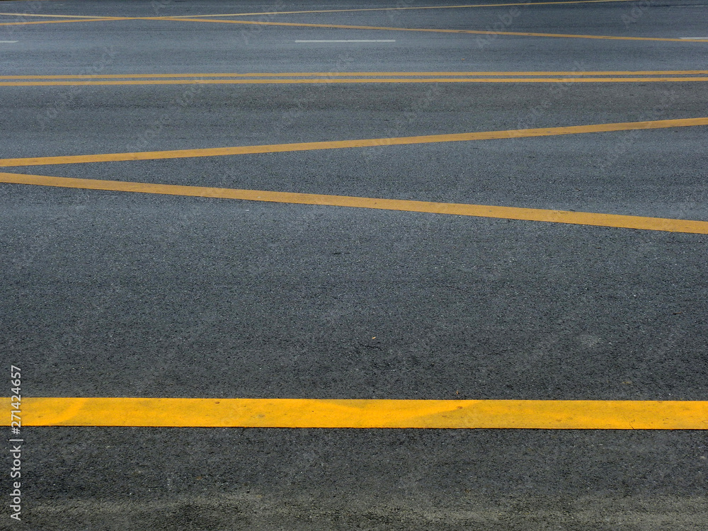 asphalt road with yellow line texture