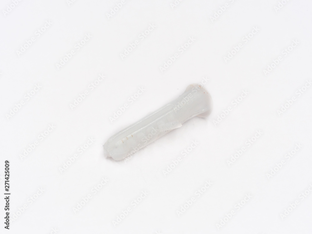 White plastic wall plug shot on white. White plastic wall plug shot on white.