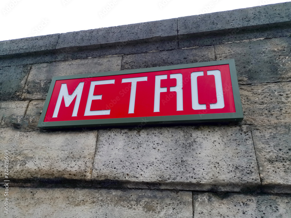 Naklejka premium Red Metro sign on a wall