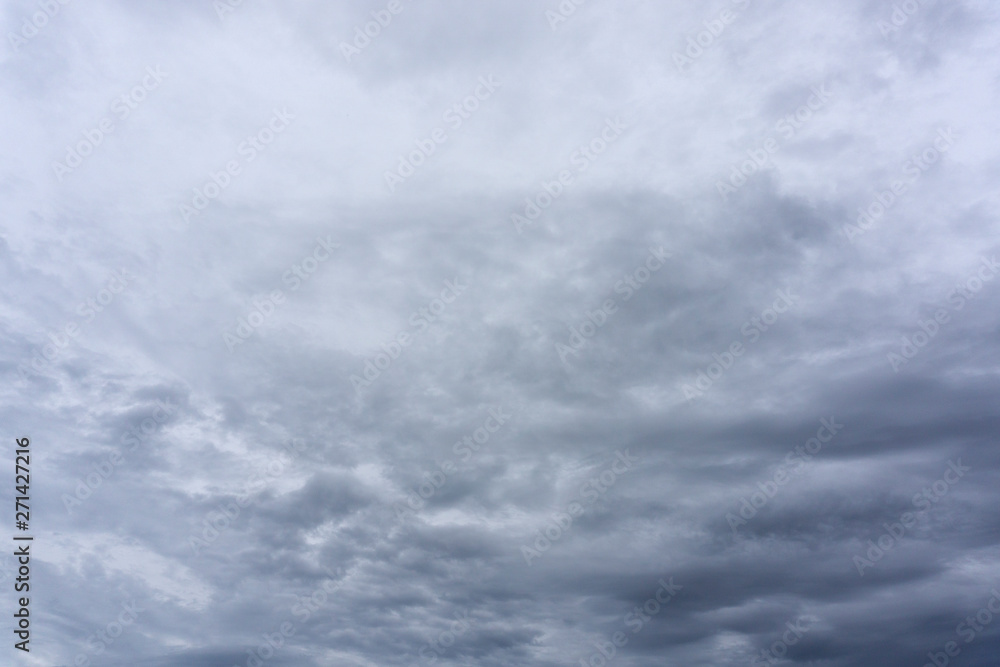 Beautiful rain clouds in the sky. Gray dark clouds in the Storm cloud on background. Beautiful rain clouds in the sky. Gray dark clouds in the Storm cloud on background.
