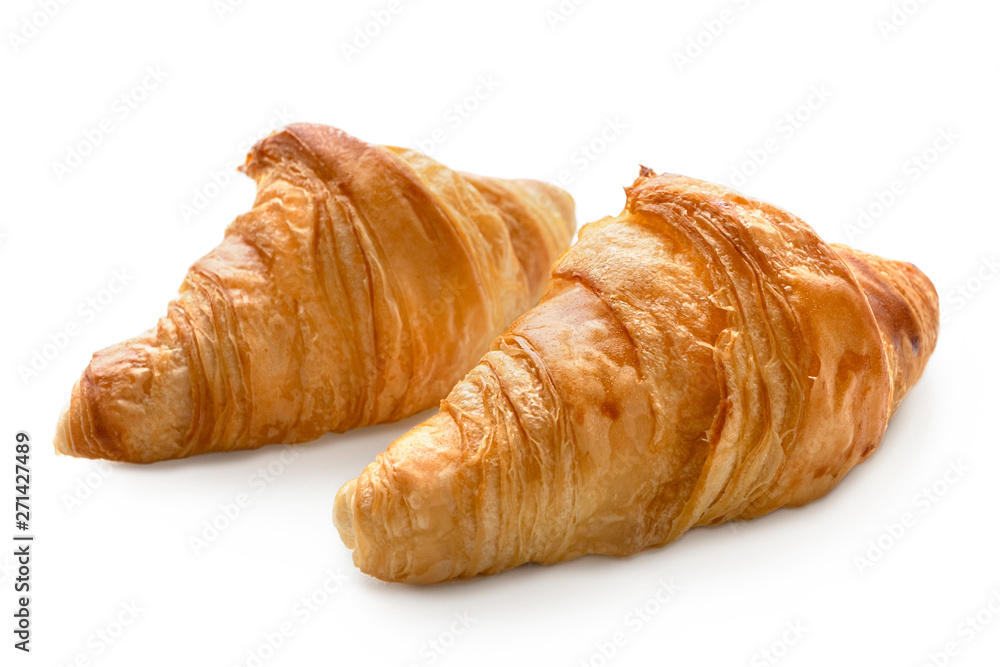 Two baked plain croissants isolated on white.