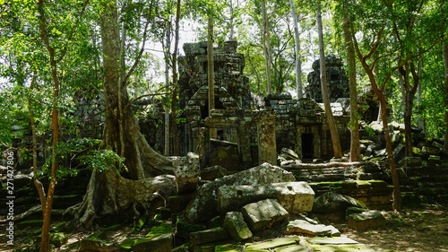 Ruined architectural heritage of Ta Phrom ancient temple complex with old scattered stones and rock.  Angkor Wat  UNESCO World Heritage Site  Siem Reap  Cambodia 