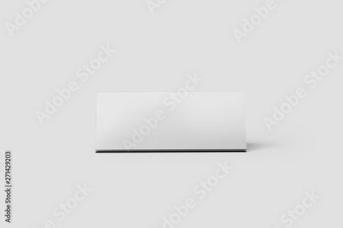 Blank Paper Table Tent Mock up isolated on light gray background. Paper card with reflection.