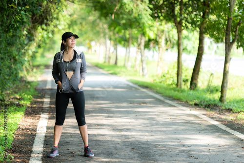 Running woman. Sport Women standing before jogging during outdoor Workout in a Park. Weight Loss and Healthy Concept