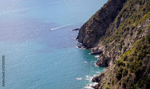 Corniglia / Italy - April 28 2019: View of the vineyards and cliffs surrounding Corniglia (Cinque Terre) from the nearby hiking trails.