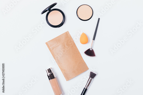 Makeup background of beige cosmetic products