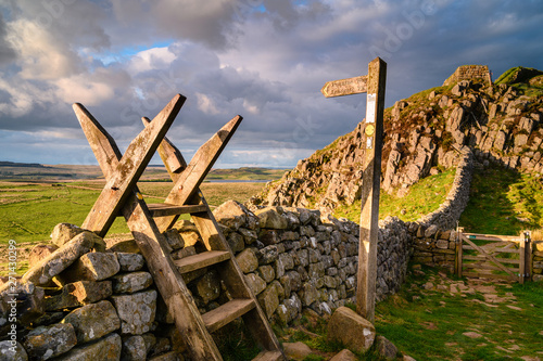 Pennine Way Style and Sign Post at Hadrian's Wall, a UNESCO World Heritage Site in the beautiful Northumberland National Park. popular with walkers along the Hadrian's Wall Path and Pennine Way