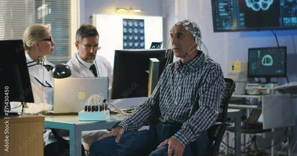 Patient answering doctors questions during brain scan Patient answering doctors questions during brain scan