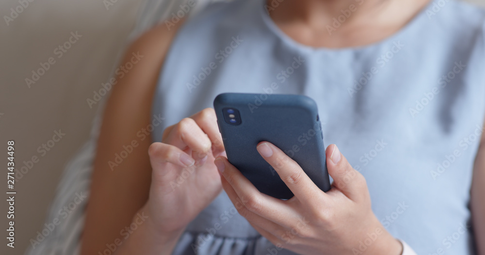 Woman use of smart phone at home Woman use of smart phone at home