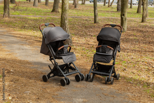 Beautiful baby carriage in the park. New design.