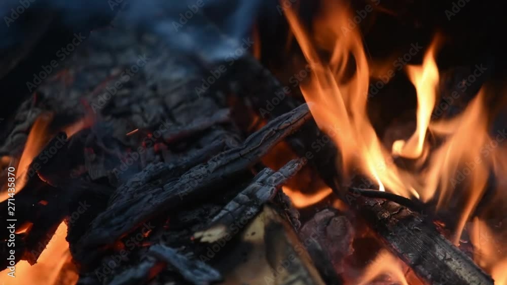 Fireplace burning. Warm cozy burning fire in a brick fireplace close up. Cozy background. Fireplace burning. Warm cozy burning fire in a brick fireplace close up. Cozy background.