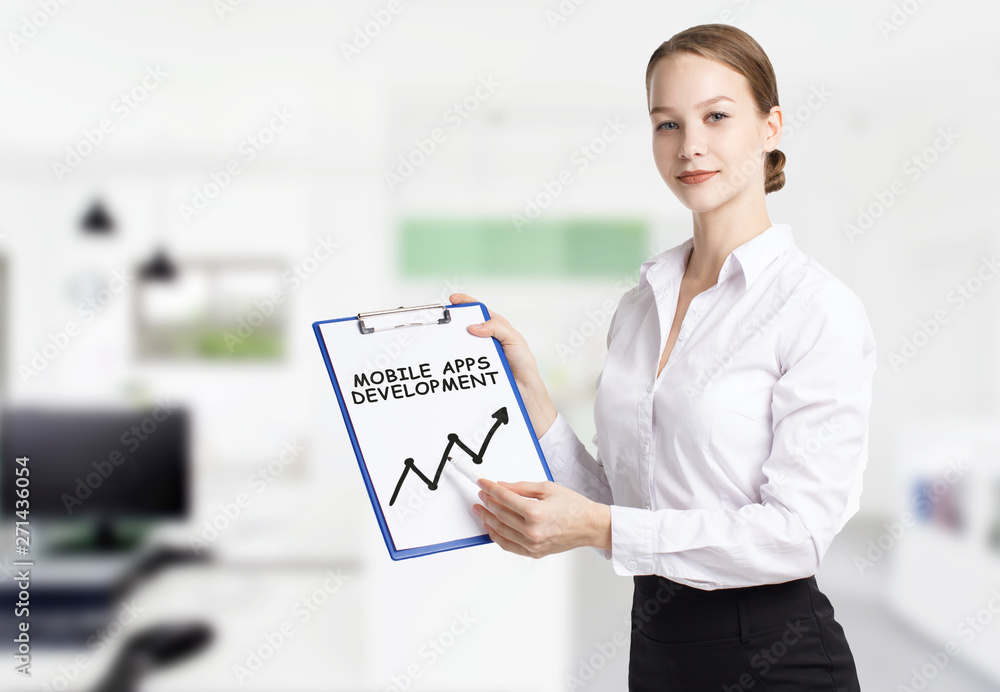 Business, technology, internet and networking concept. Young entrepreneur showing keyword: Mobile apps development Business, technology, internet and networking concept. Young entrepreneur showing keyword: Mobile apps development