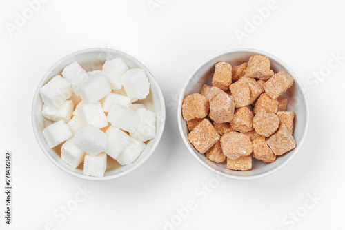 White refined sugar and brown unrefined sugar cubes