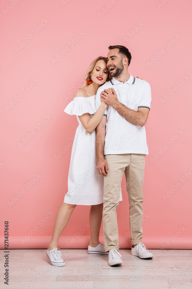 Happy beautiful couple standing isolated Happy beautiful couple standing isolated