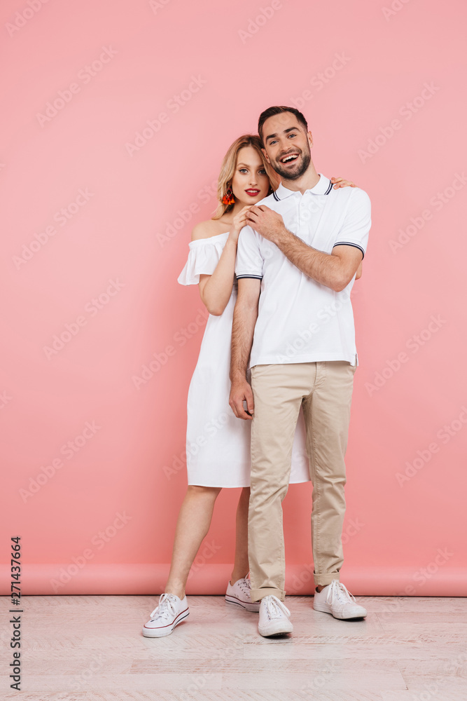Happy beautiful couple standing isolated Happy beautiful couple standing isolated