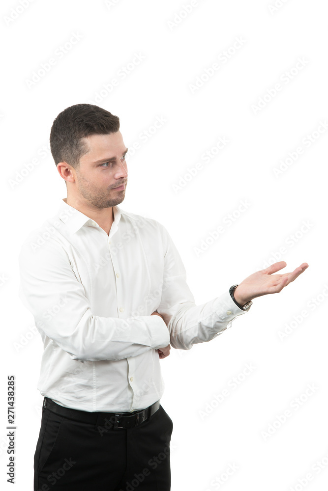 friendly young man pointing to his side and looking into the camera. isolated on white background friendly young man pointing to his side and looking into the camera. isolated on white background