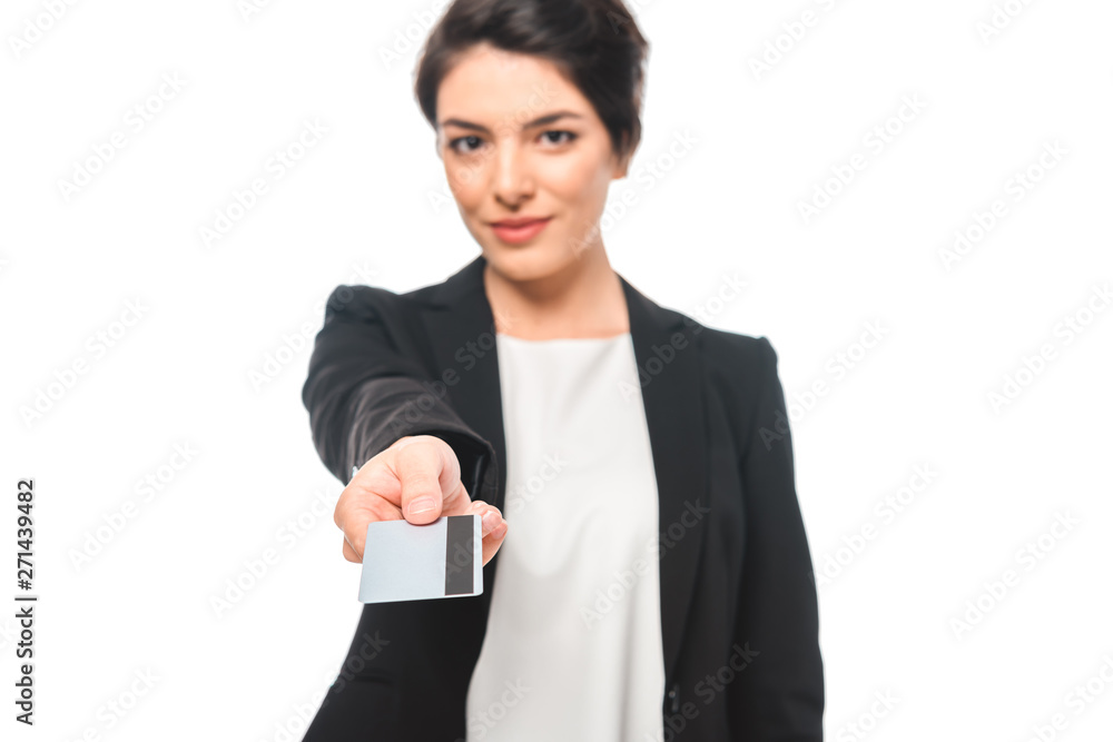 selective focus of attractive mixed race businesswoman presenting credit card while smiling at camera isolated on white selective focus of attractive mixed race businesswoman presenting credit card while smiling at camera isolated on white