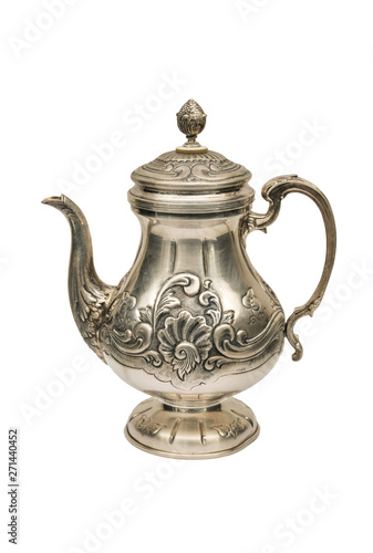 An antique kettle of silver on a white background.