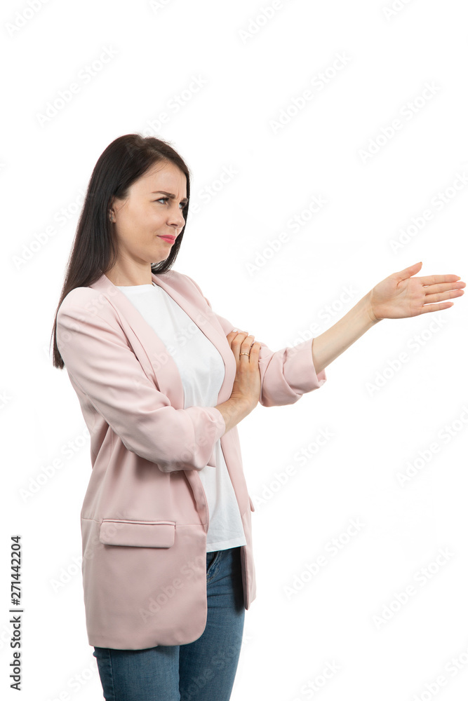 friendly young woman pointing to his side and looking into the camera. isolated on white background friendly young woman pointing to his side and looking into the camera. isolated on white background