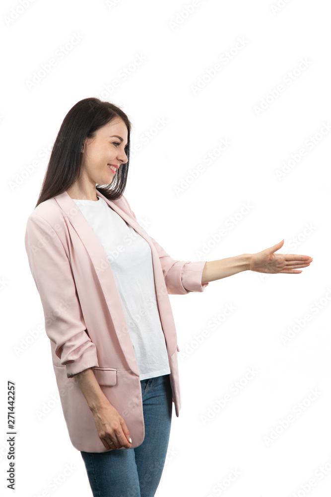 friendly young woman pointing to his side and looking into the camera. isolated on white background friendly young woman pointing to his side and looking into the camera. isolated on white background