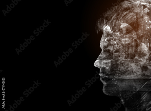 Double exposured abstract young man silhouette person double exposure blended with an architectural background with copy space, isolated on black. Mixed media artwork design background concept