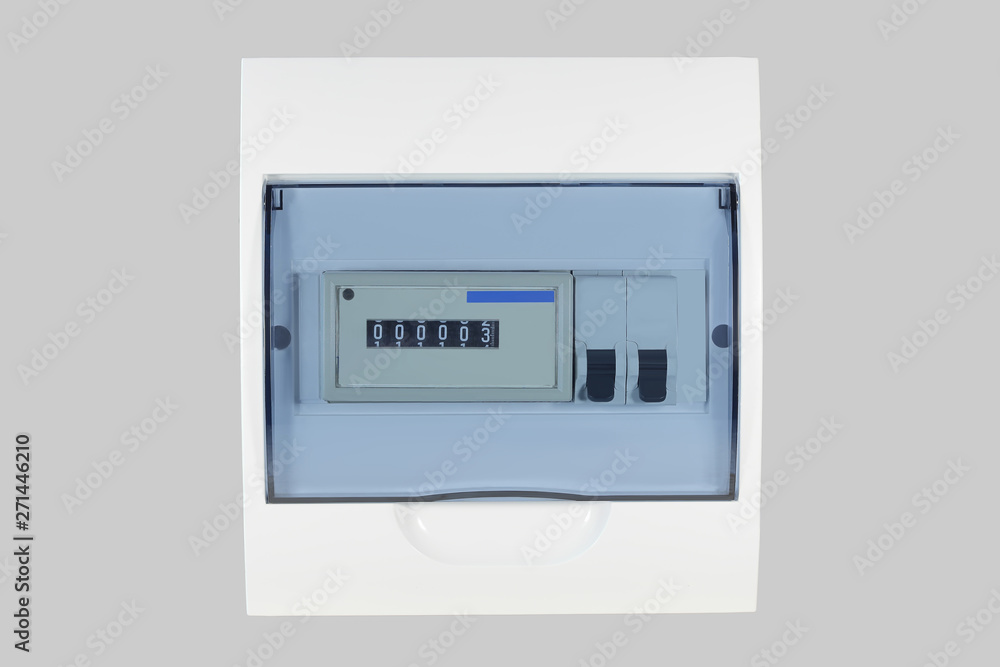 White plastic shield with electricity meter and circuit breakers for country house isolated on grey background White plastic shield with electricity meter and circuit breakers for country house isolated on grey background