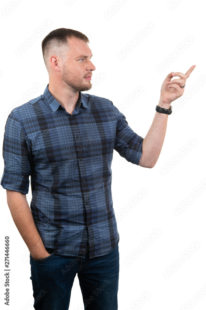 friendly young man pointing to his side and looking into the camera. isolated on white background friendly young man pointing to his side and looking into the camera. isolated on white background