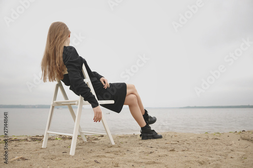 Stylish girl posing in stylish clothes