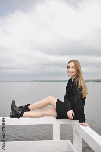 Stylish girl posing in stylish clothes