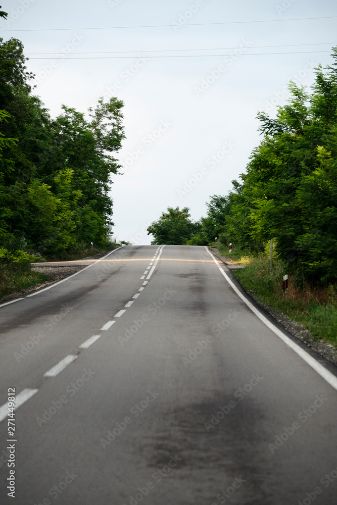 Fototapeta premium View from driving position through the window on empty road.