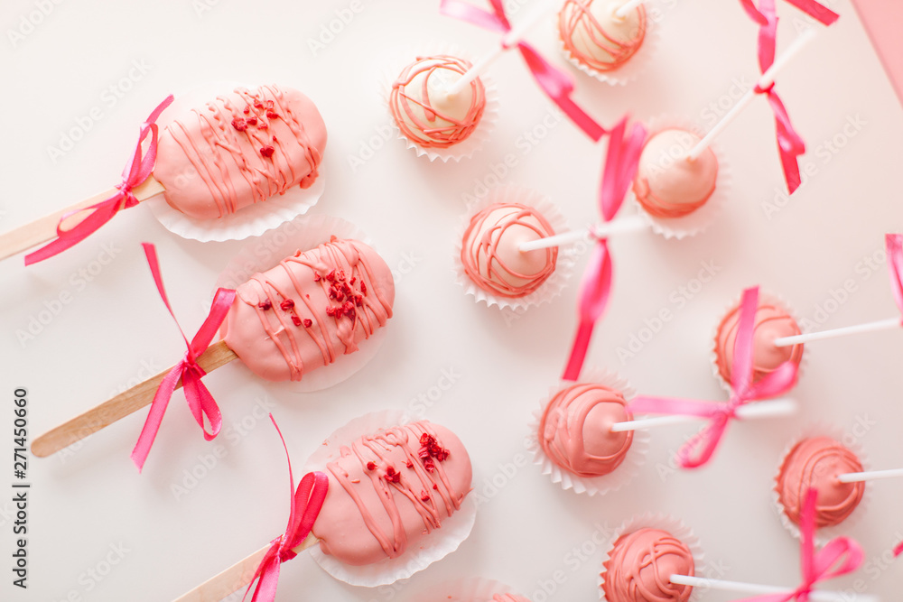 cake popsicle on a pink background cake popsicle on a pink background