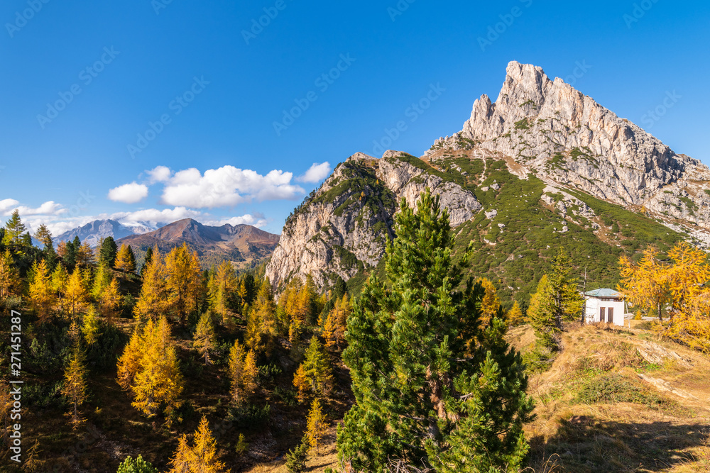 Beautiful alpine countryside. Scenic image of famous Sassolungo peak with overcast perfect blue sky. Wonderful Vall Gardena under sunlight. Majestic Dolomites Mountains. Amazing nature Landscape