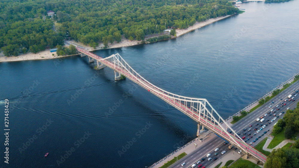 glass pedestrian and bicycle bridge. touristic place. Kiev, Ukraine. drone shot, bird's-eye, aerial view